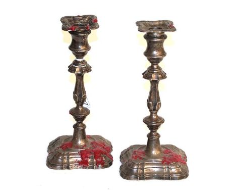 An Edward VII and a George V Silver candlestick, by Fordham and Faulkner, Sheffield, 1908 and 1910, each on shaped case and w