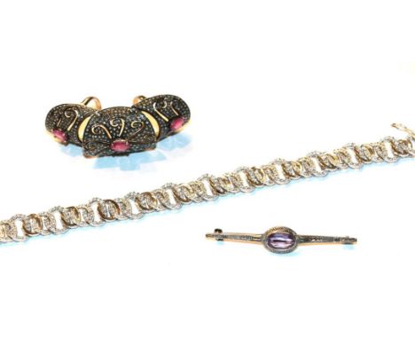 An amethyst bar brooch, stamped '925', length 5.8cm; a paste full finger ring; and a silver bracelet, length 19cm (a.f.).  Gr