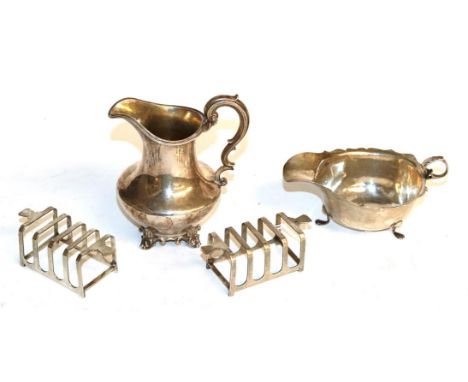 A Victorian silver cream-jug, by Edward, Edward, John and William Barnard, London, 1843, with reeded scroll handle; together 