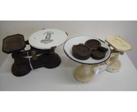 Pair of Victorian cast metal kitchen scales with ceramic plate and another similar set with a selection of weights (2) 