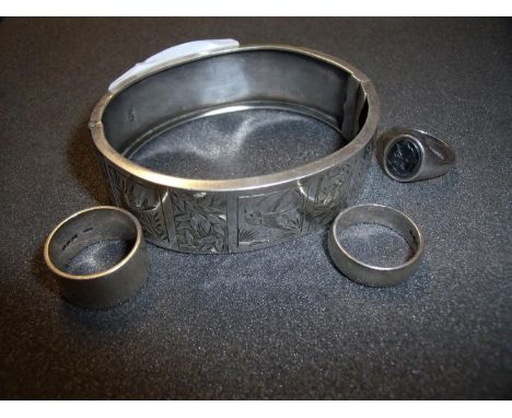 Engraved folding silver hallmarked bangle, two silver hallmarked rings and a white metal signet style ring set with Intaglio 