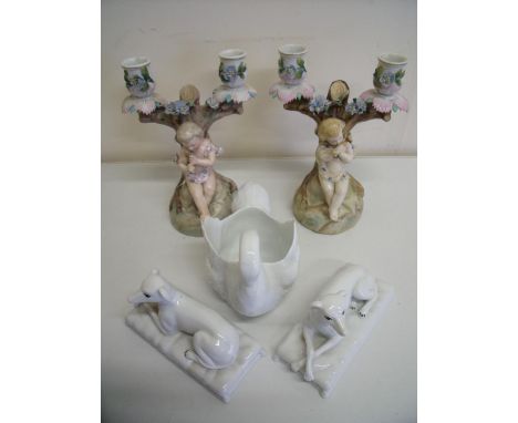 Pair of continental twin branch Bisque style candlesticks with cherubs (the bases stamped RBS4674), a small ceramic swan plan