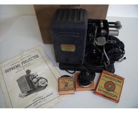 Boxed Supreme 9.5mm projector 230v Model No 925-2 with a selection of various film reels including Mickey Mouse in original b