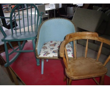 Painted Ercol stick back child's rocking chair, a small child's Lloyd Loom type armchair and another elm child's chair (3) 