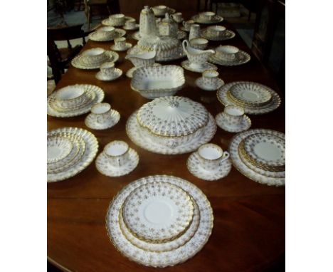 Comprehensive Spode Fleur De Lys gold pattern dinner service comprising of eight plus settings, teapot, coffee pot, tureens, 