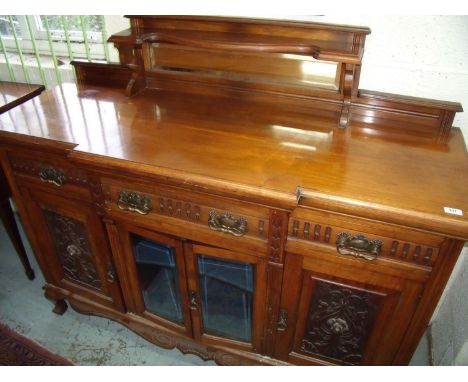 19th/20th C mahogany break front side board with O raised mirror back above three frieze drawers, two bevelled edged glazed c