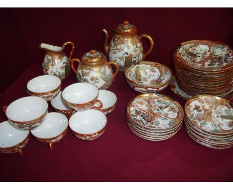 Early 20th C Japanese part tea service comprising of tea cups, saucers, side plates, sugar bowl, tea pot, jug etc with three 