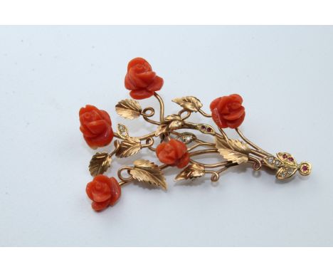 18k Gold, Red Coral, Diamond &amp; Ruby Floral Pin. Having 5 carved red coral flowers, 8 small diamonds, and 5 small rubies m