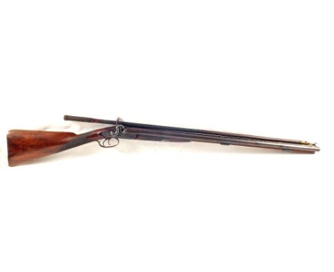 A double barrel muzzle loading shotgun of approx 17 bore complete with powder flask, cap tin and cleaning rod