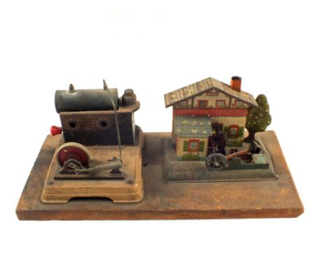 A stationary steam engine with a tin plate cottage waterwheel