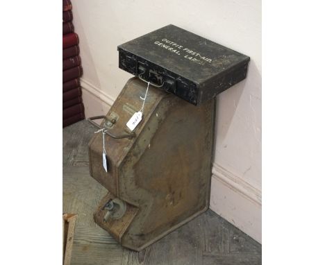 A military first aid tin with a WII era vehicle water tank