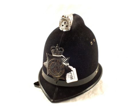 A Police helmet with North Wales plate