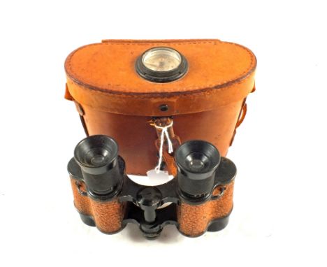 A U.S.A. pair of WWII era binoculars marked 'Signal Corps U.S. Army' in their original case with built in compass