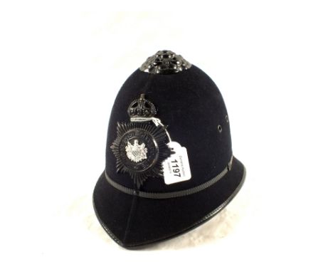 A Police helmet with Manchester Police plate (Kings Crown pre 1952)