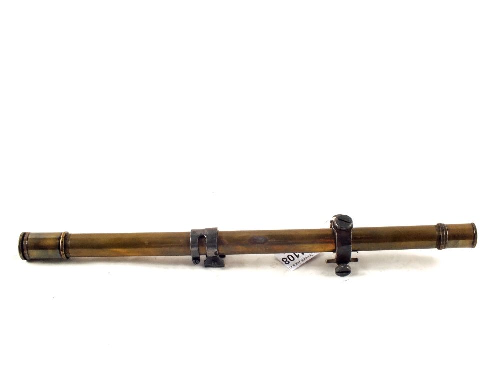 A vintage Brass telescopic sight by Winchester, marked on rear mount