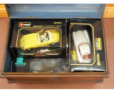 Five boxed Burago and Solido models