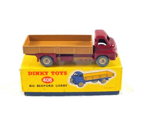 A boxed Dinky No.408 big Bedford lorry, maroon cab, light tan tack and cream hubs (back had 522 stamped on it)