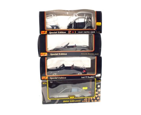 Four Maisto and other boxed 1:18 scale models