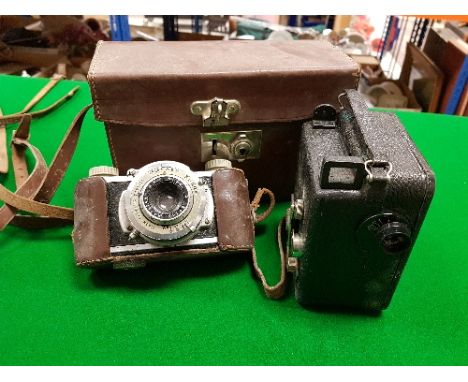 Two pre-war cameras, a Cine Nizo and a Kodak 35 camera together with a boxed mini cine containing various films to include "D