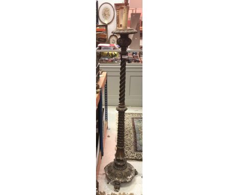 A gilt standard lamp with barley-twist column, a 19th Century brass table lamp in the Gothic taste together with two gilded w