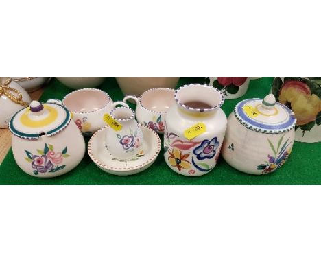 Seven pieces of Poole pottery including preserve pots, small dish, two vases and two handled pots