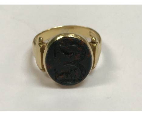 A Victorian 18 carat gold seal ring, the blood stone centre inscribed with the arms of the Forbes Leith family with stag's he