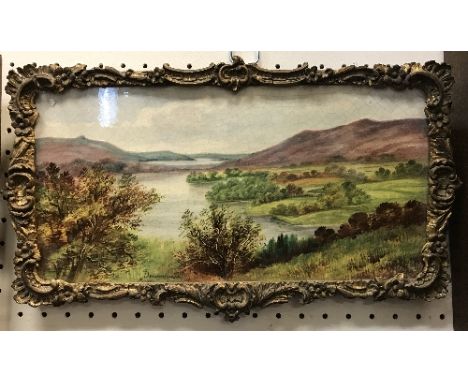 A framed painted ceramic tile of a landscape overlooking some lakes, indistinctly titled lower left