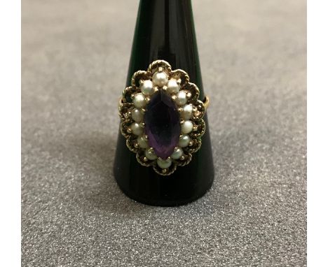 A Victorian gold seed pearl and amethyst mounted dress ring CONDITION REPORTS We can't give the ring size but the internal me