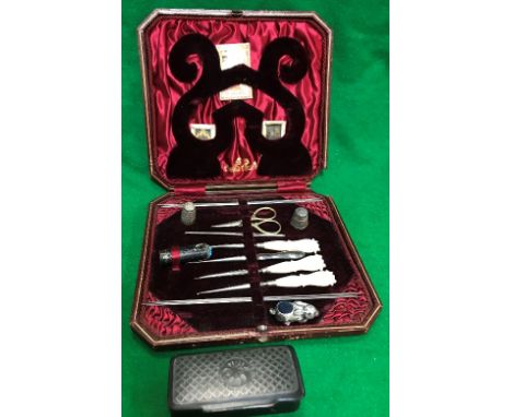 A silver rabbit pin cushion and two thimbles with cased sewing kit and snuff box
