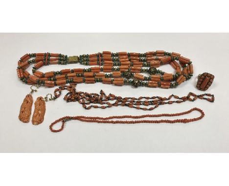 A collection of vintage coral jewellery comprising three necklaces, a 9 carat gold mounted ring and a pair of carved Chinese 