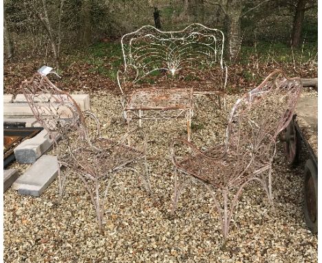 A matching white painted wrought iron garden table, a bench and two chairs CONDITION REPORTS Clearly been outside for some ye