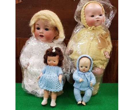 A collection of vintage dolls and teddies to include an Armand Marseille porcelain headed baby doll stamped "MA Germany 341.3