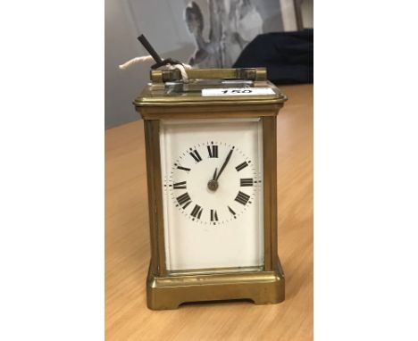 A French brass five glass carriage clock, the white enamel dial set with Roman numerals
