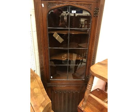 A mid 20th Century carved oak and leaded glazed free-standing corner cupboard, two slat back chairs, oak drop-leaf tea table,