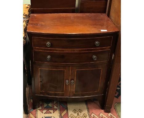 A 19th Century mahogany and inlaid commode chest of single deep drawer as two and further deep drawer as two cupboard drawers
