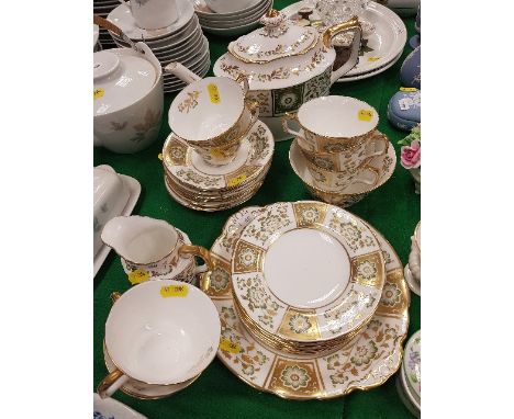 A modern Royal Crown Derby "Green Derby" panel decorated tea set comprising teapot, eight cups, saucers and tea plates, sandw