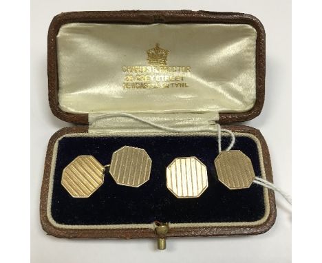 A pair of 9 carat engine turned cufflinks