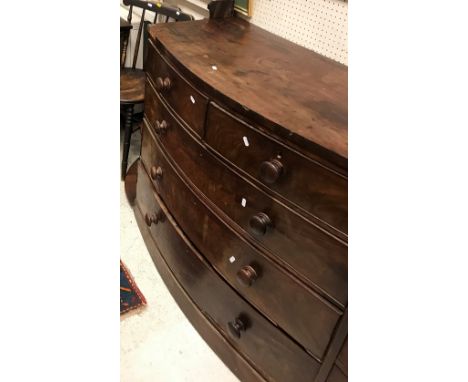 A 19th Century mahogany bow fronted chest of two short over three long graduated drawers, a four tier corner shelf unit, oak 