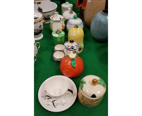 A collection of eight various preserve pots including two Radford, one Bristol, three Carlton ware, one Arthur Wood, one Clar