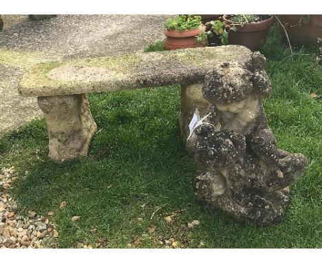 A concrete garden bench, together with a concrete statue of two children