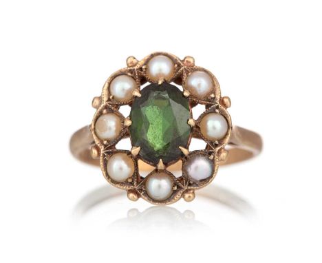 TOURMALINE AND PEARL RING, set with a central tourmaline within a halo of seed pearls, in nine carat gold, size OQty: 3.3gPea