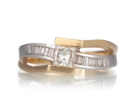 DIAMOND CROSSOVER RING, set with a central princess cut stone above a row of baguette cut stones, marked 14KT, size M 1/2Qty: