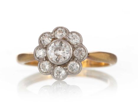 DIAMOND CLUSTER RING, the diamonds totalling approximately 0.70 carats, marks worn, size J 1/2Qty: 2.6gGenerally worn. Slight