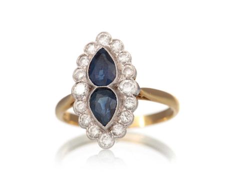 SAPPHIRE AND DIAMOND DRESS RING, set with two pear shaped sapphires within a diamond halo, in eighteen carat gold, size PQty: