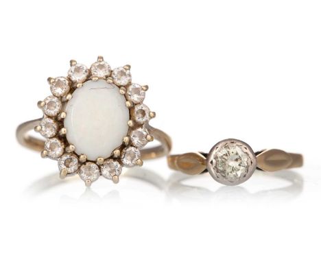 OPAL DRESS RING, the oval opal within a halo of white paste stones, in nine carat gold, along with a small diamond solitaire 