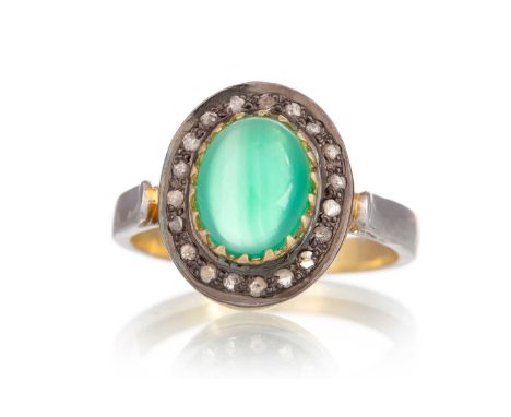 GREEN ONYX AND DIAMOND RING, set with a cabochon green onyx within a halo of diamonds, size N, in silver