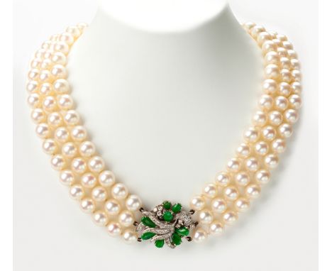  A Cultured Pearl, Jade and Diamond Necklace composed of three graduating strands of cultured pearls measuring approximately 