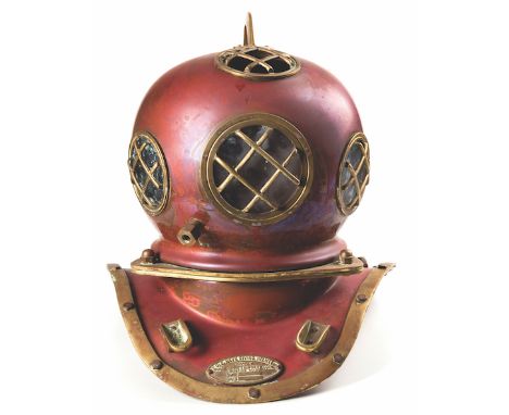  A Vintage U.S. Navy Mark V Style Brass And Copper Diving Helmet with rounded glassed portals and protective bars, the neck a