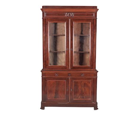 A Continental Mahogany Bookcase, Late 19th Century plain stepped top above a moulded frieze, a pair of moulded glazed doors 