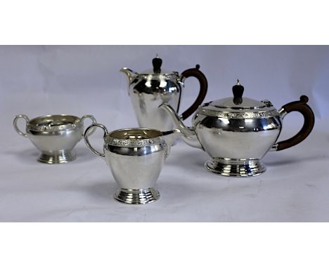  A George VI Four-Piece Tea Set, Mappin & Webb Ltd, London, 1947 comprising: a teapot, a hot water jug, a milk jug and two-ha